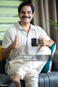 Black coffee for liver health in mug with thumbs up gesture